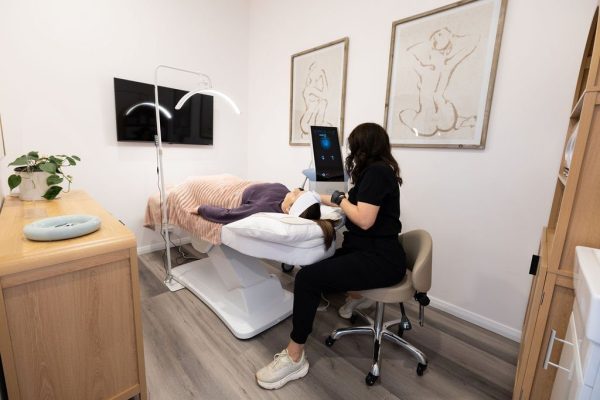 Jacci performing an Exion face treatment in the treatment room at The Effortless Clinic, Gungahlin