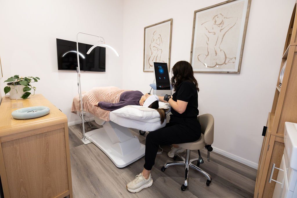 Jacci performing an Exion face treatment in the treatment room at The Effortless Clinic, Gungahlin