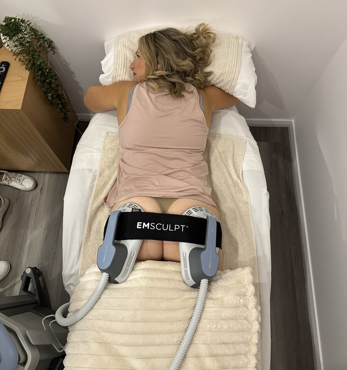 Emsculpt applicators during a glute session at The Effortless Clinic.