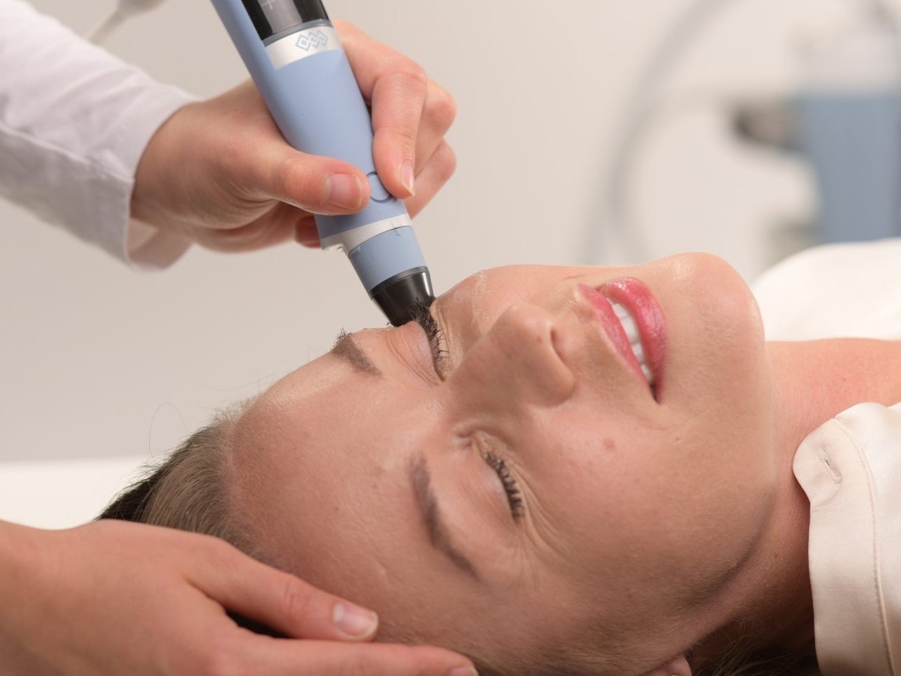 Exion RF microneedling handpiece during a face treatment