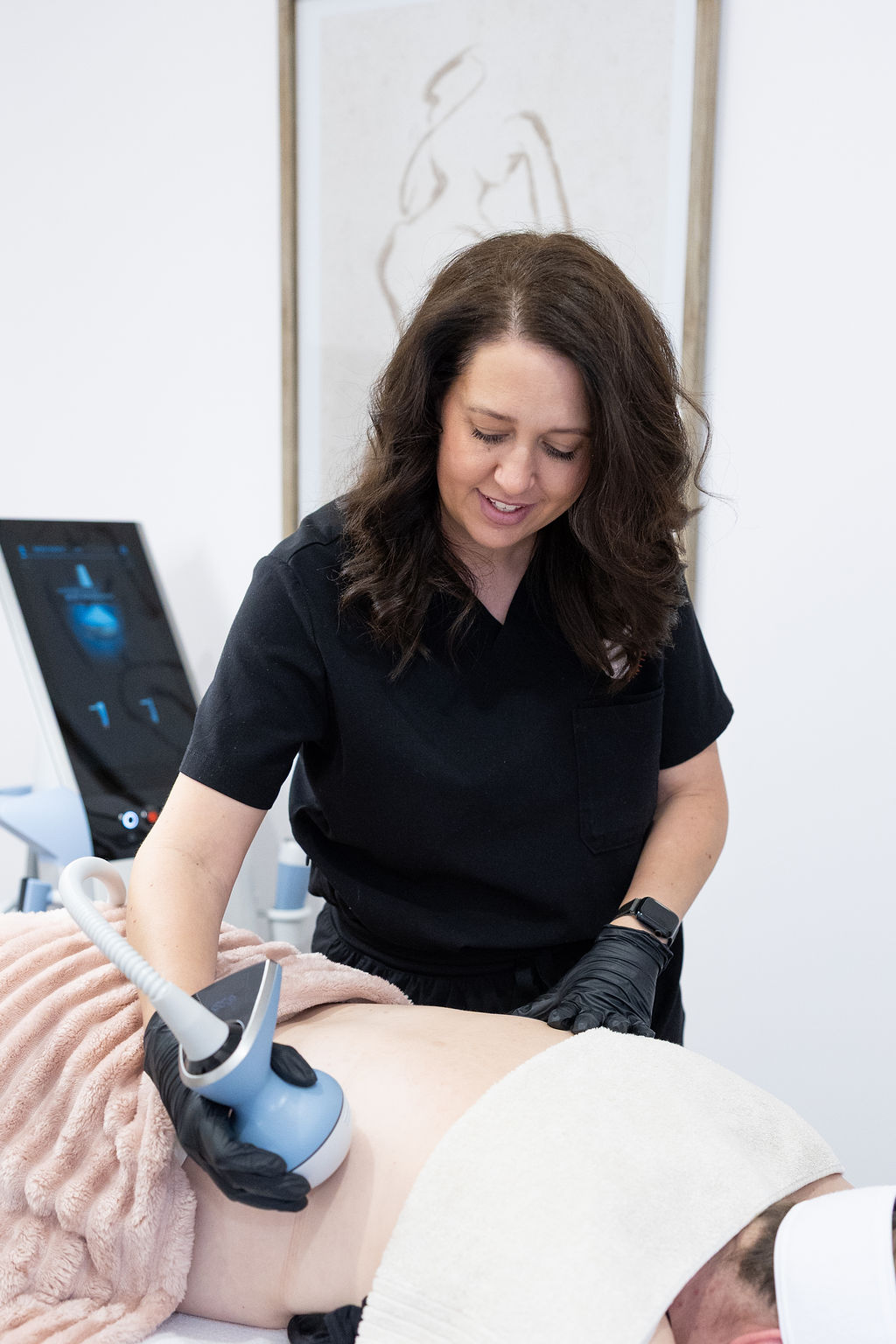 Jacci giving an Exion body treatment at The Effortless Clinic